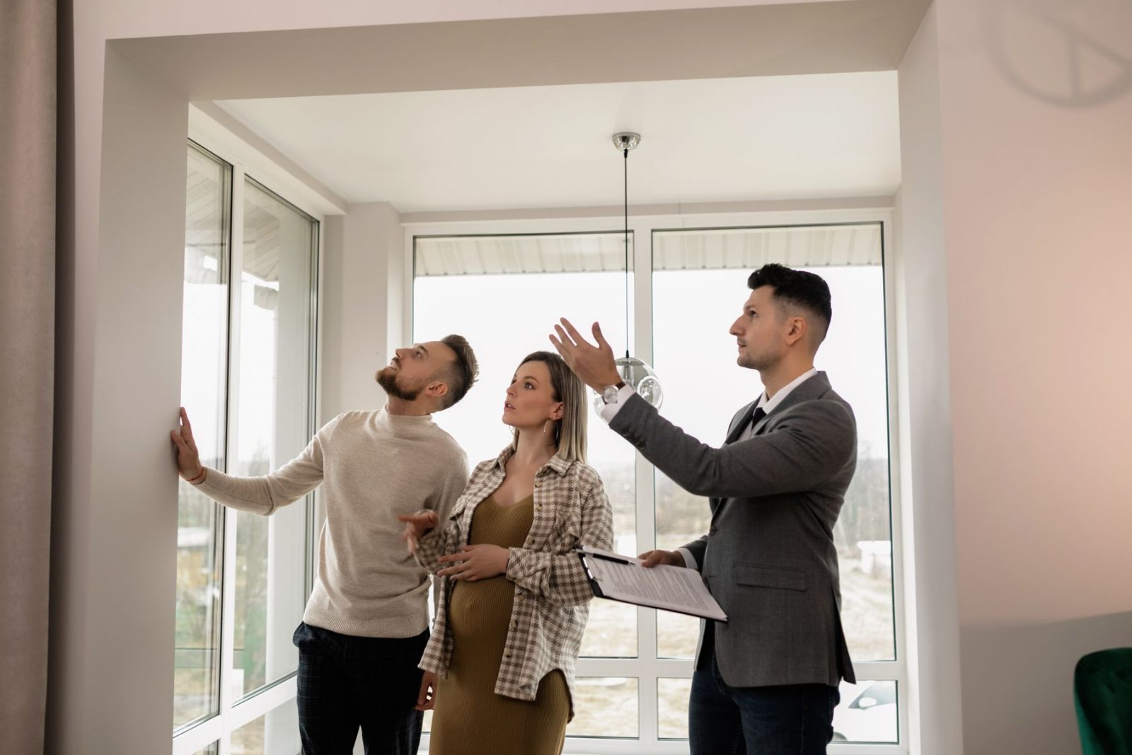A leasing agent showing an apartment to a couple