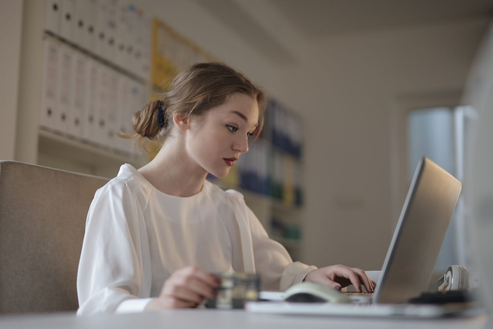 An administrator working at a laptop